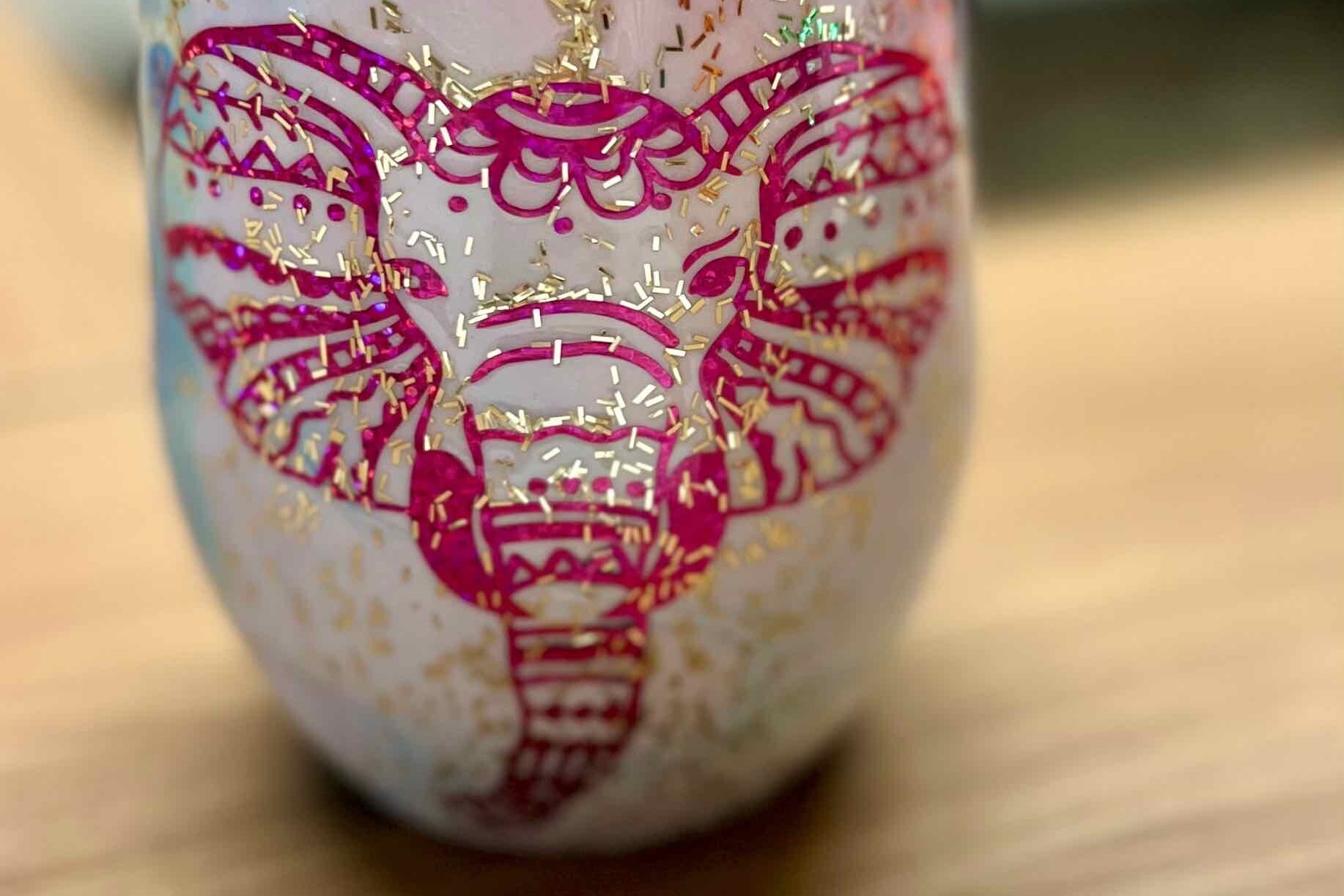 cup designed with a bright pink elephant with gold glitter